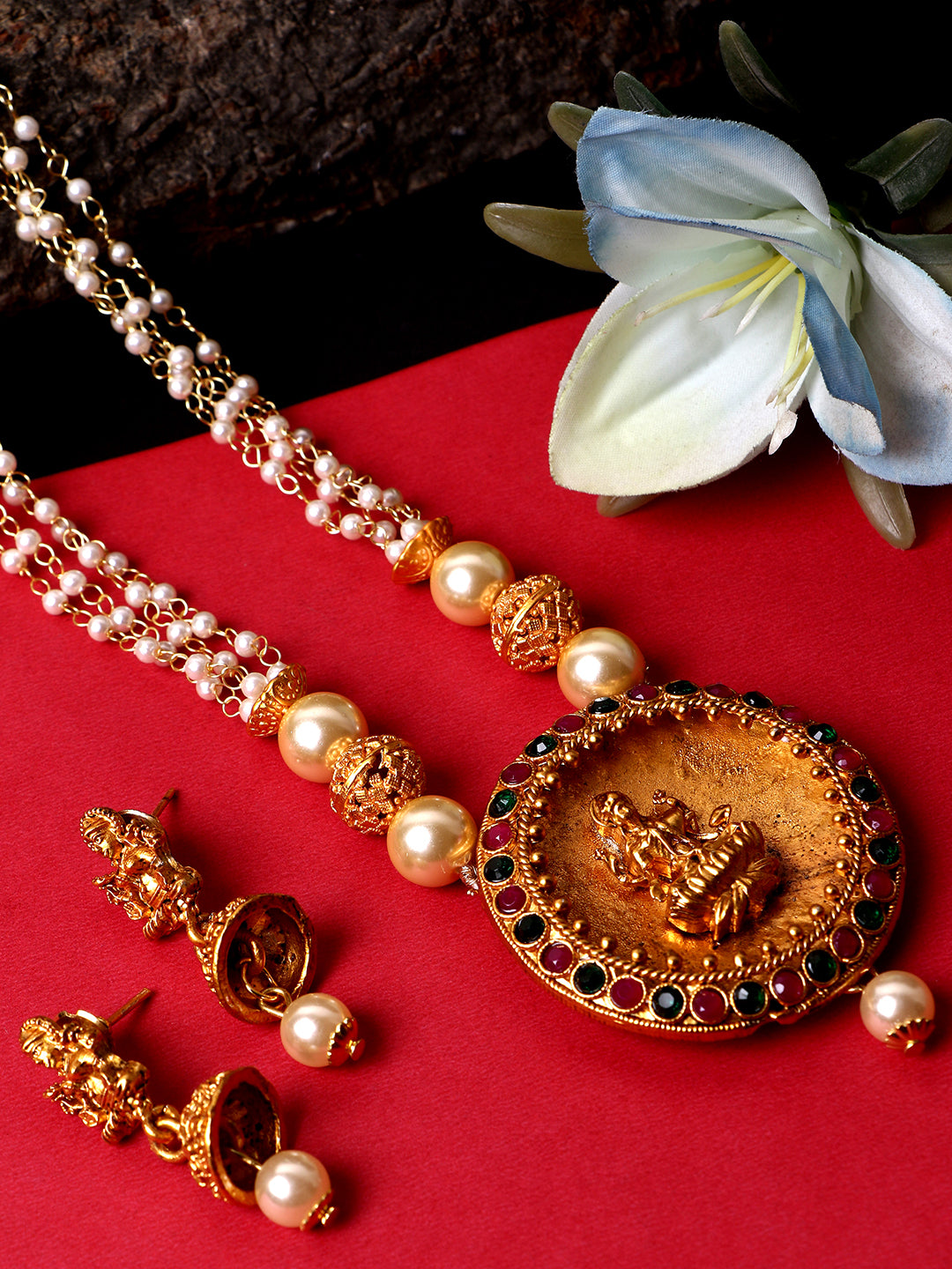 Women's Antique Matte Gold Finish Goddess Laxmi Green Stone Studded Temple Jewellery set