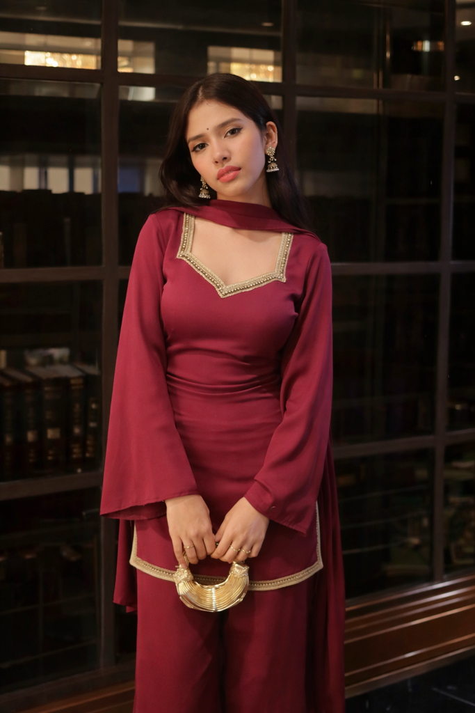 Women's Maroon Kurta with Flared Palazzo Set with Golden Embellished Neckline