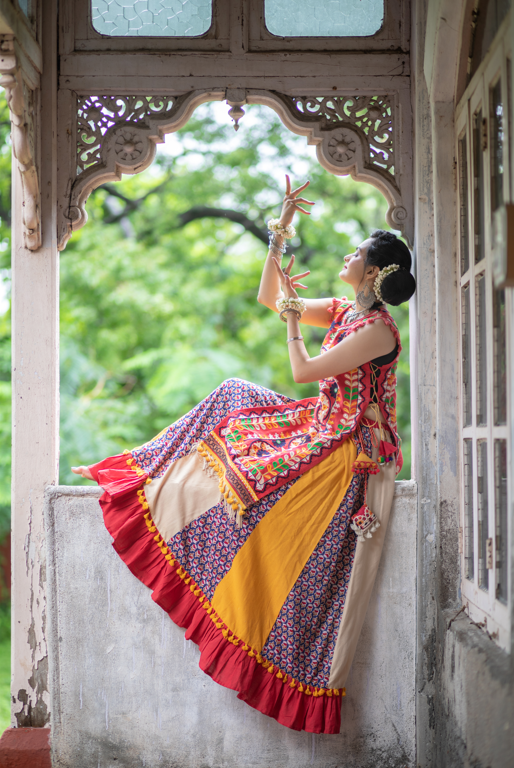 Women's Red Circular Treditional Embroidered Panel Top Paired With Multicolor Flairy Skirt