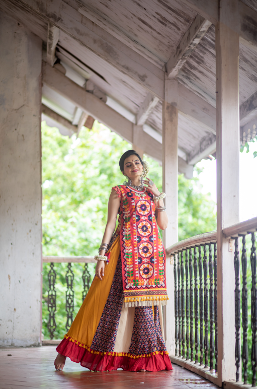 Women's Red Circular Treditional Embroidered Panel Top Paired With Multicolor Flairy Skirt