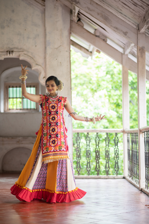 Women's Red Circular Treditional Embroidered Panel Top Paired With Multicolor Flairy Skirt