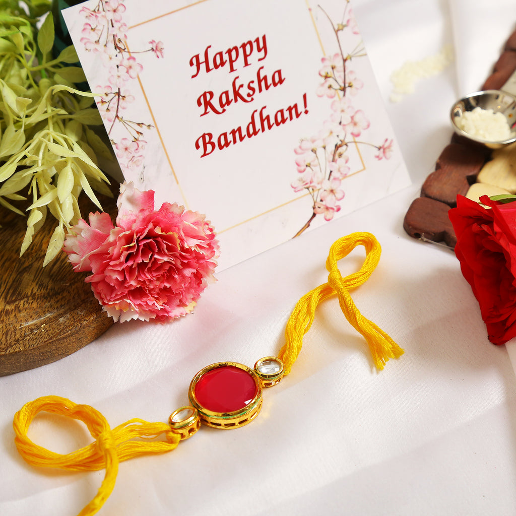 Red Gold Tone Kundan Rakhi With Yellow Thread