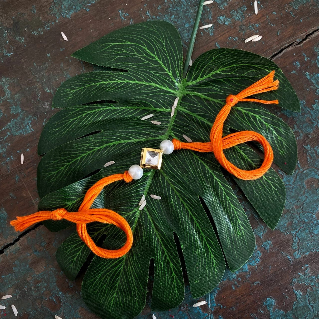 Orange Pearl Gold Tone Kundan Rakhi