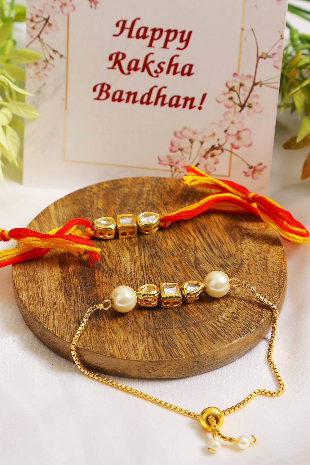 Set Of 2 - Gold-Toned Kundan Embellished Rakhi & Lumba Set