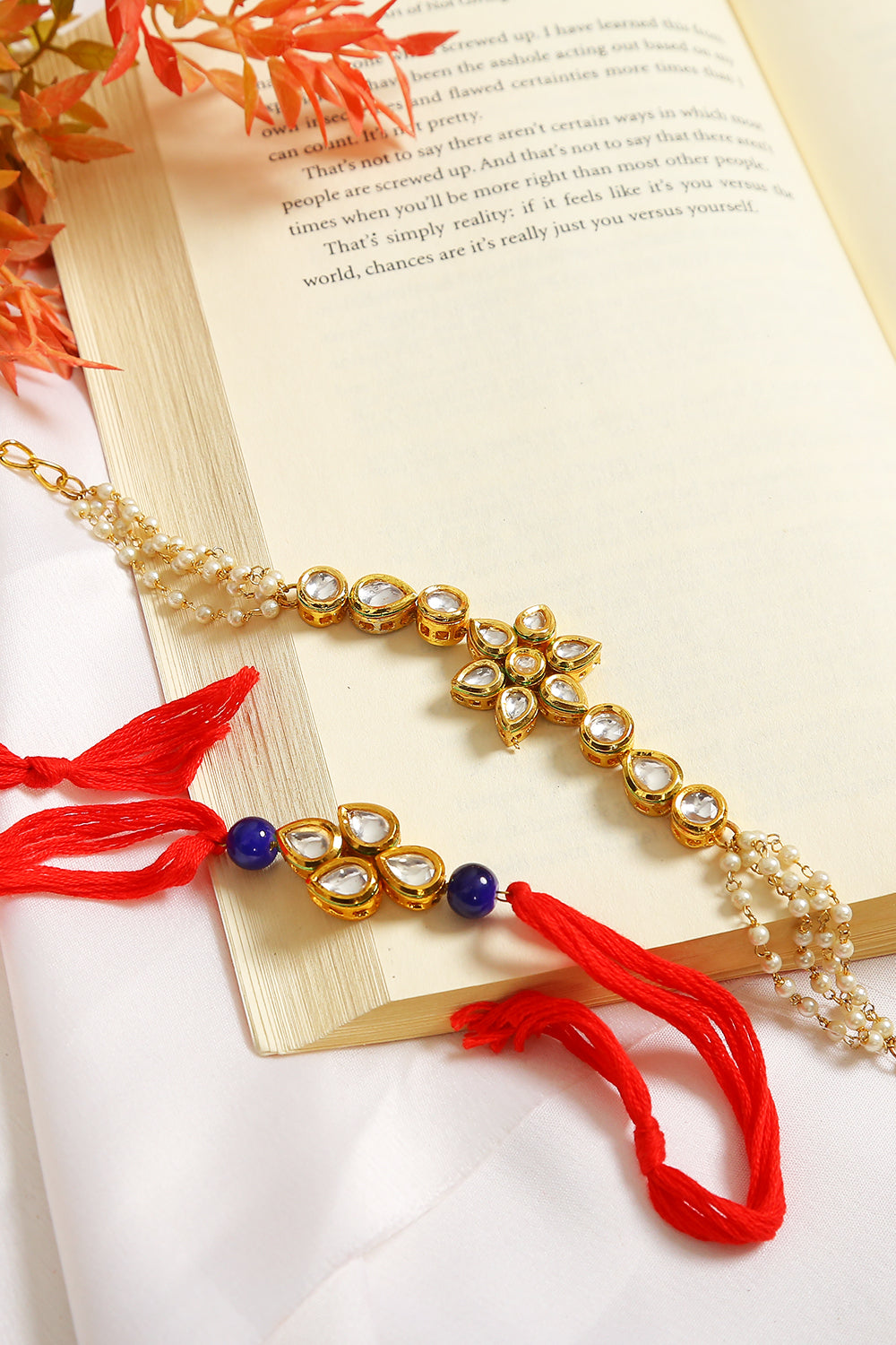 Set Of 2 - Gold-Toned Kundan Embellished Rakhi & Floral Lumba Set