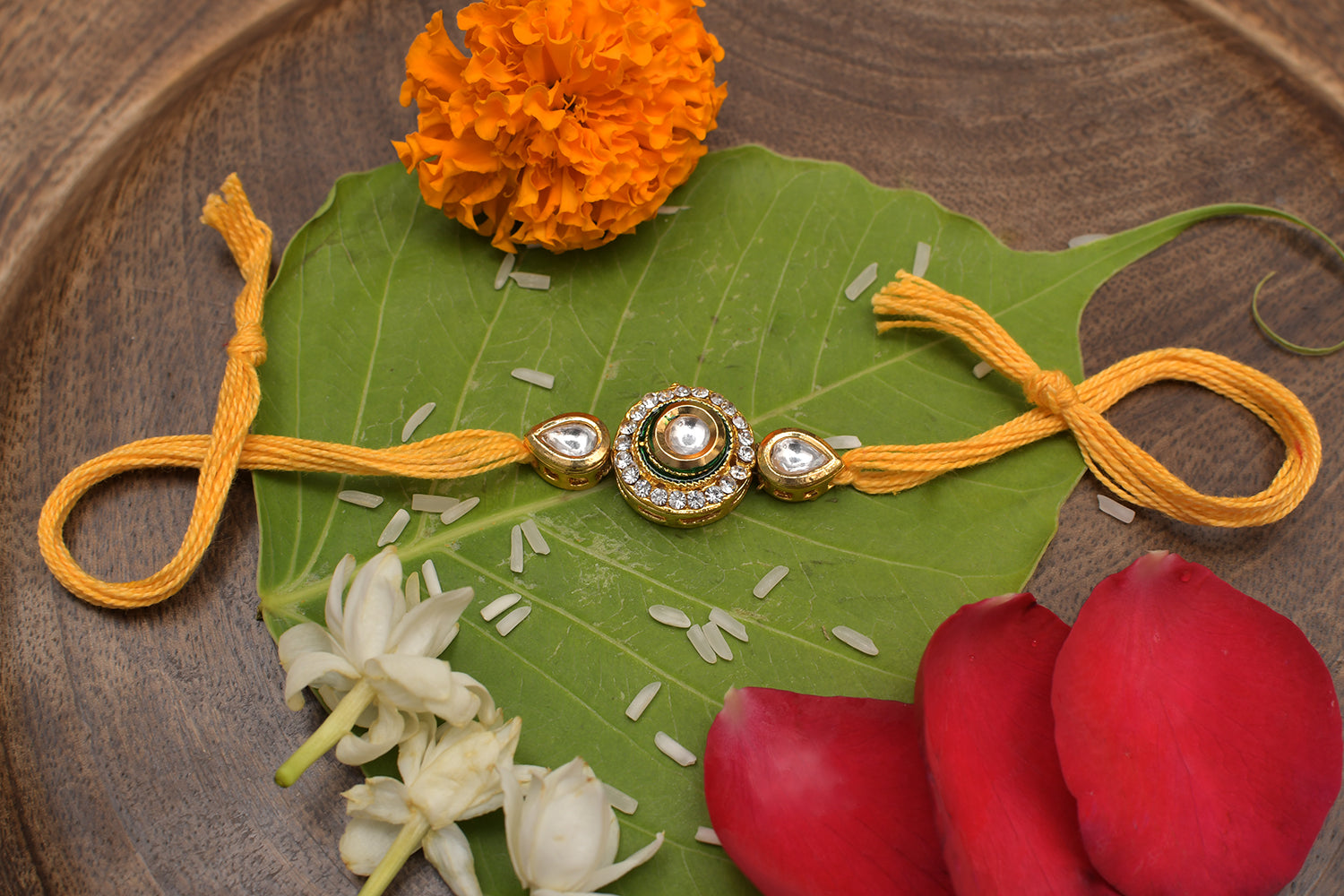High Quality Kundan Studded Rakhi With Yellow Cotton Thread
