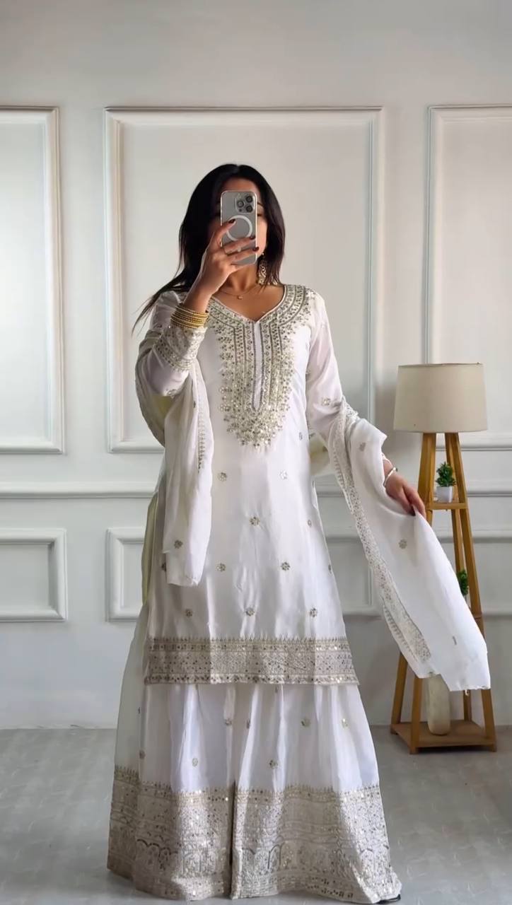 white and gold sharara dress Photo of Bride wearing a white and gold sharara set on her wedding day