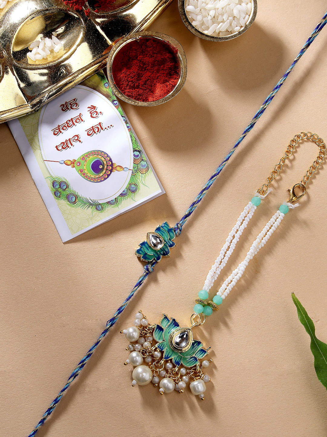 Set Of 2 Turquoise Blue Lotus Shape Kundan-Studded & Beaded Handcrafted Wraparound Rakhi Set With Roli Chawal - Nvr