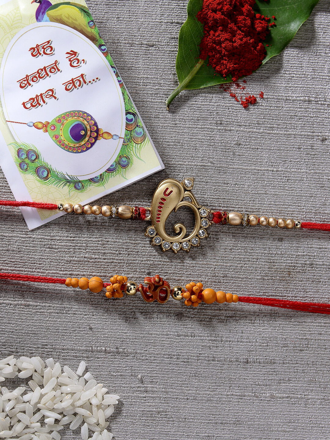 Set Of 2 Gold-Toned Ganesha Stone-Studded Rakhi With Roli Chawal & Chocolate - Nvr