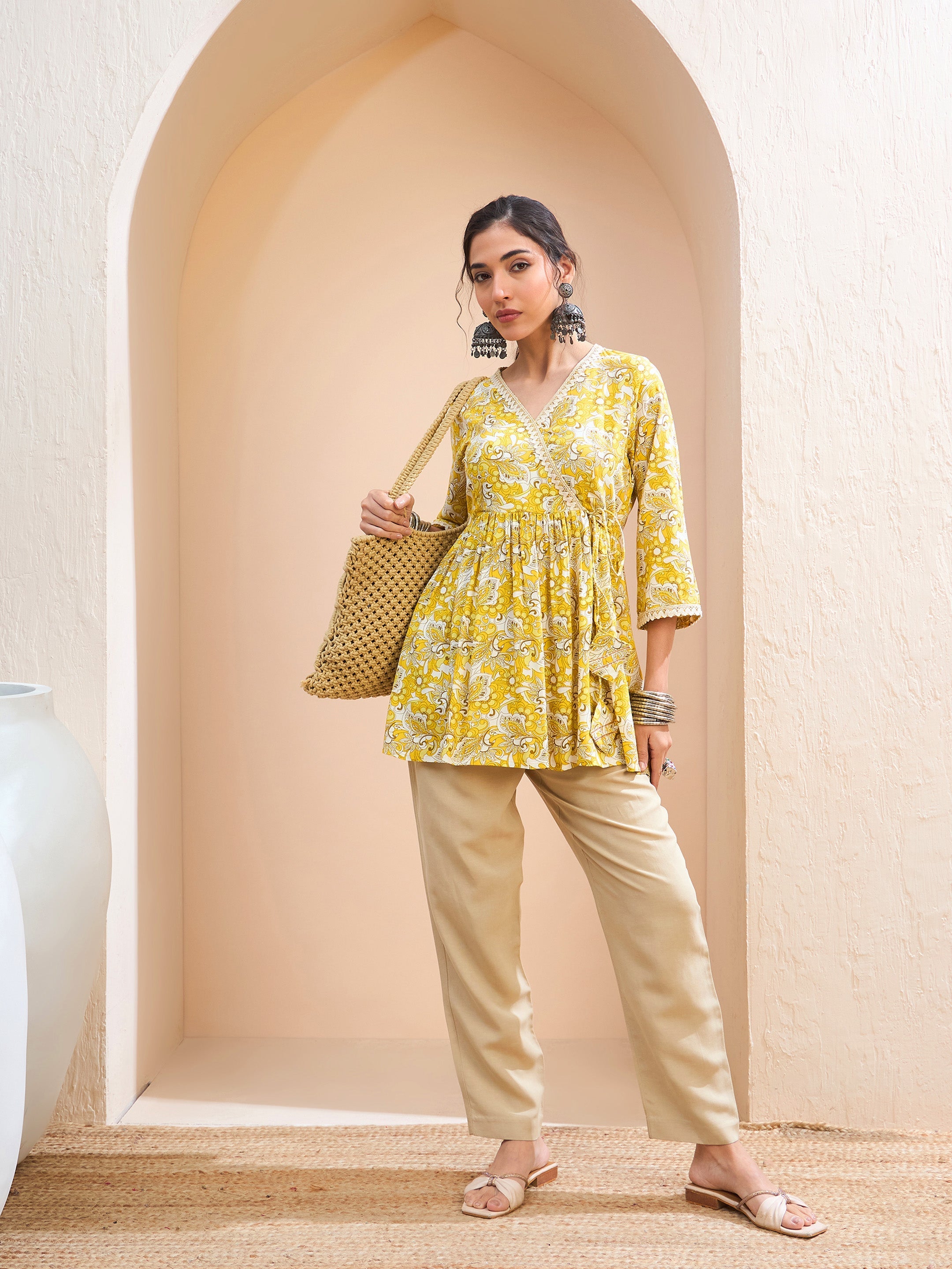 Women's Yellow Floral Wrap Neck Peplum Kurti-SHAE