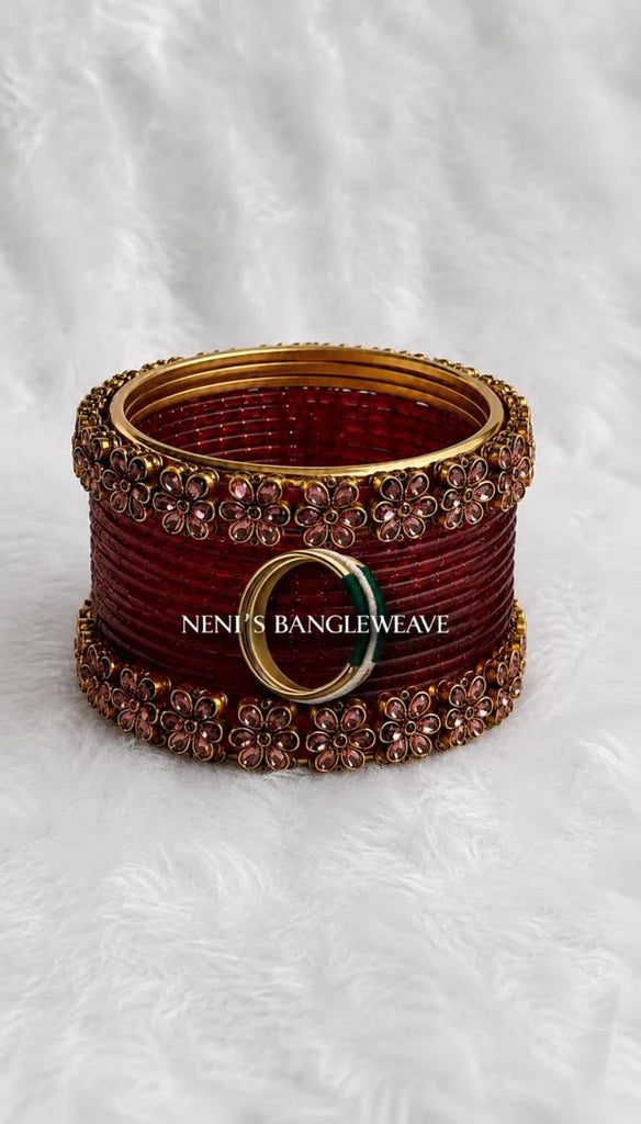 Women's Silk Thread Bangles Set With Floral Gold Embellishments