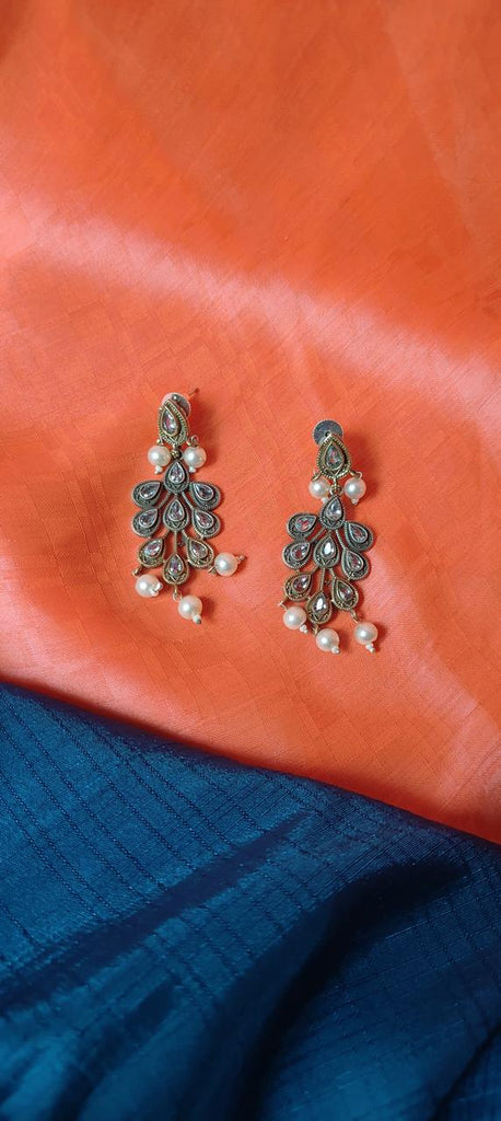 Dual tone peacock feather earrings for women