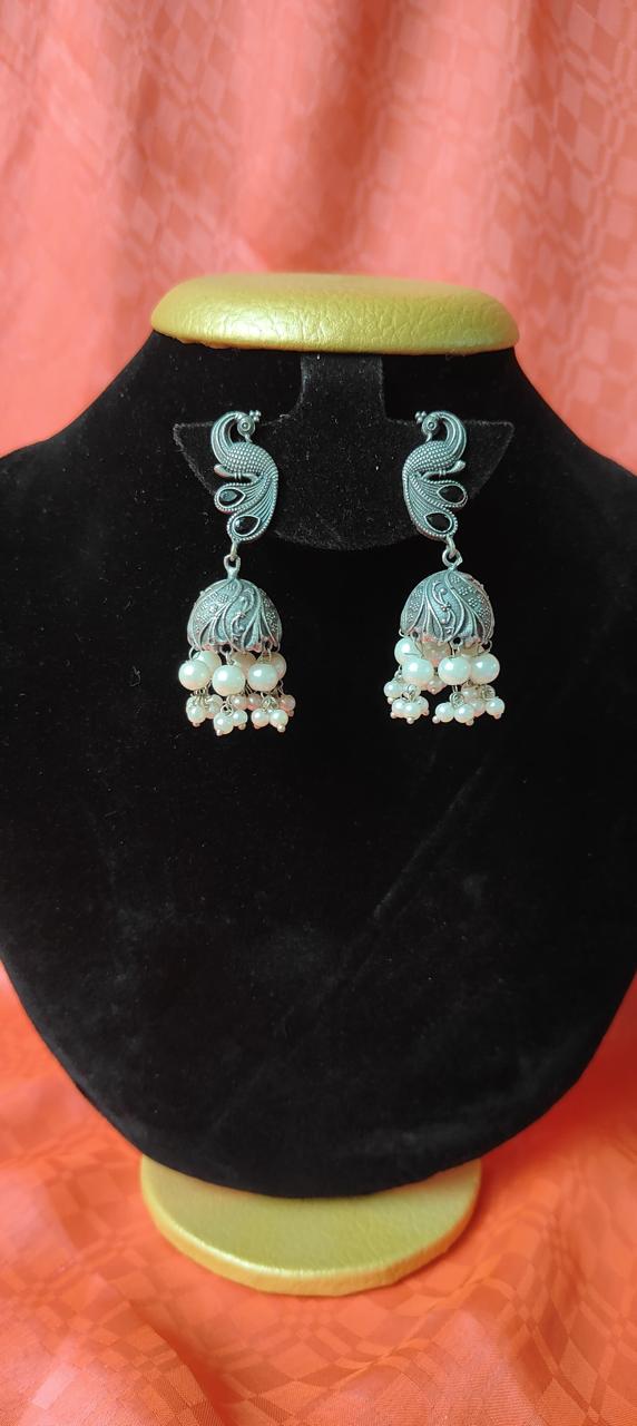 Oxidized peacock jhumka earrings for women in black stonework