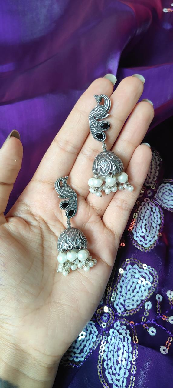 Oxidized peacock jhumka earrings for women in black stonework