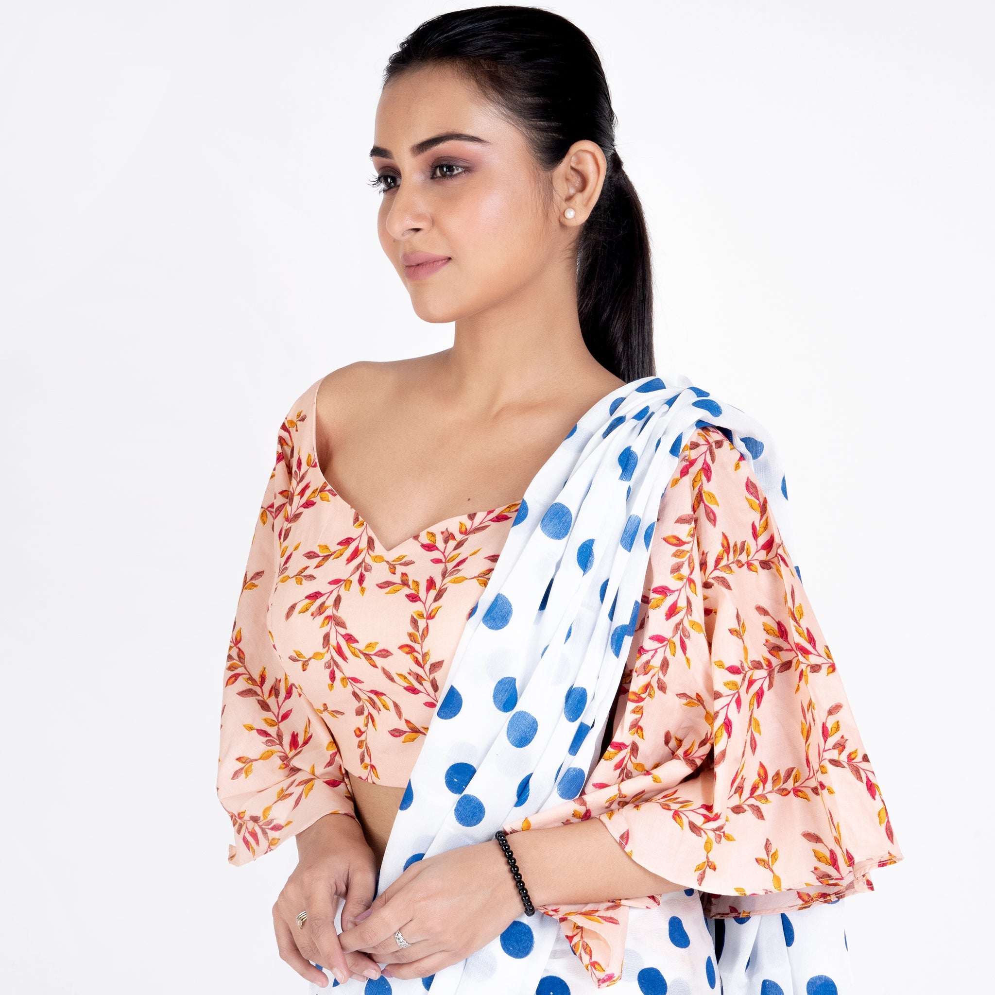 Women's Peach Printed Cotton Padded Blouse With Flaired Sleeves - Boveee