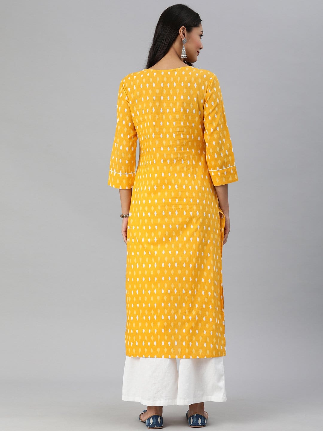 Women's KSUT Mustard And White Ikkat Printed Straight Kurta With Dori And Tassel Detailing On Neckline - Varanga