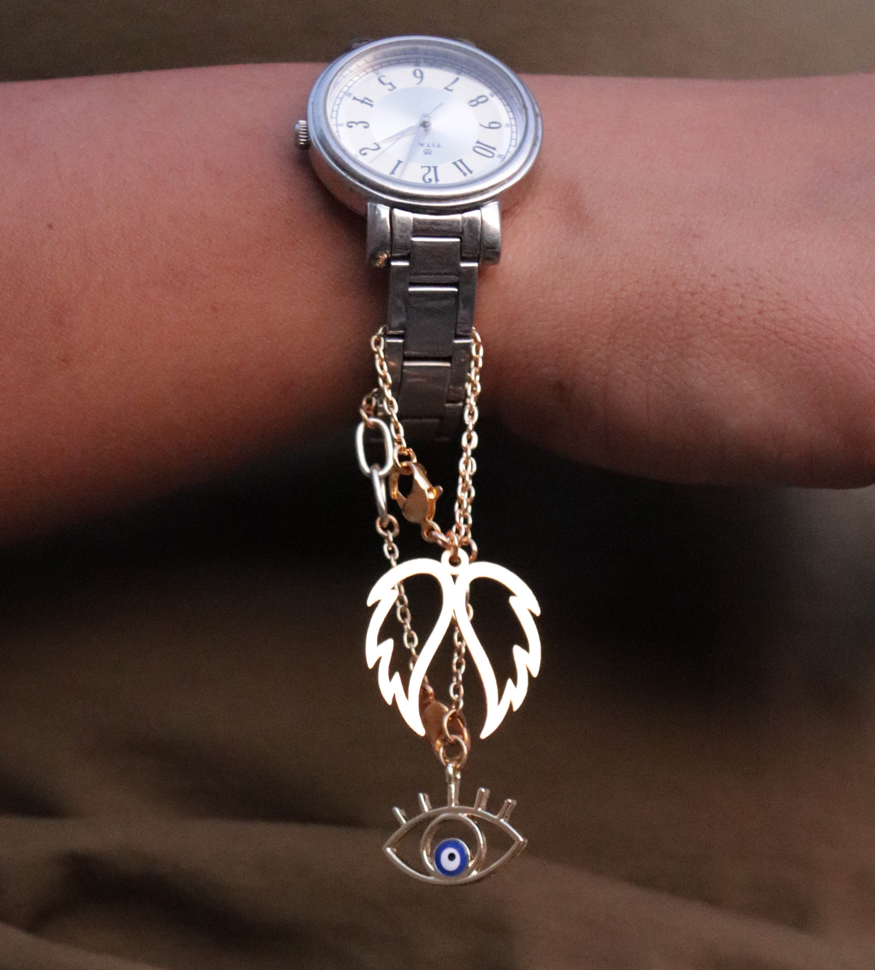 Evil Eye And Angel Wings Watch Charms Set Of 2 - Abhika Creations