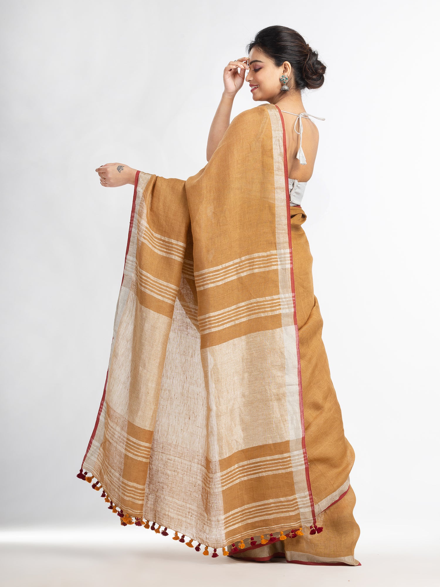 Women's saffron with silver zari pallu in silver zari border handwoven linen saree - Angoshobha