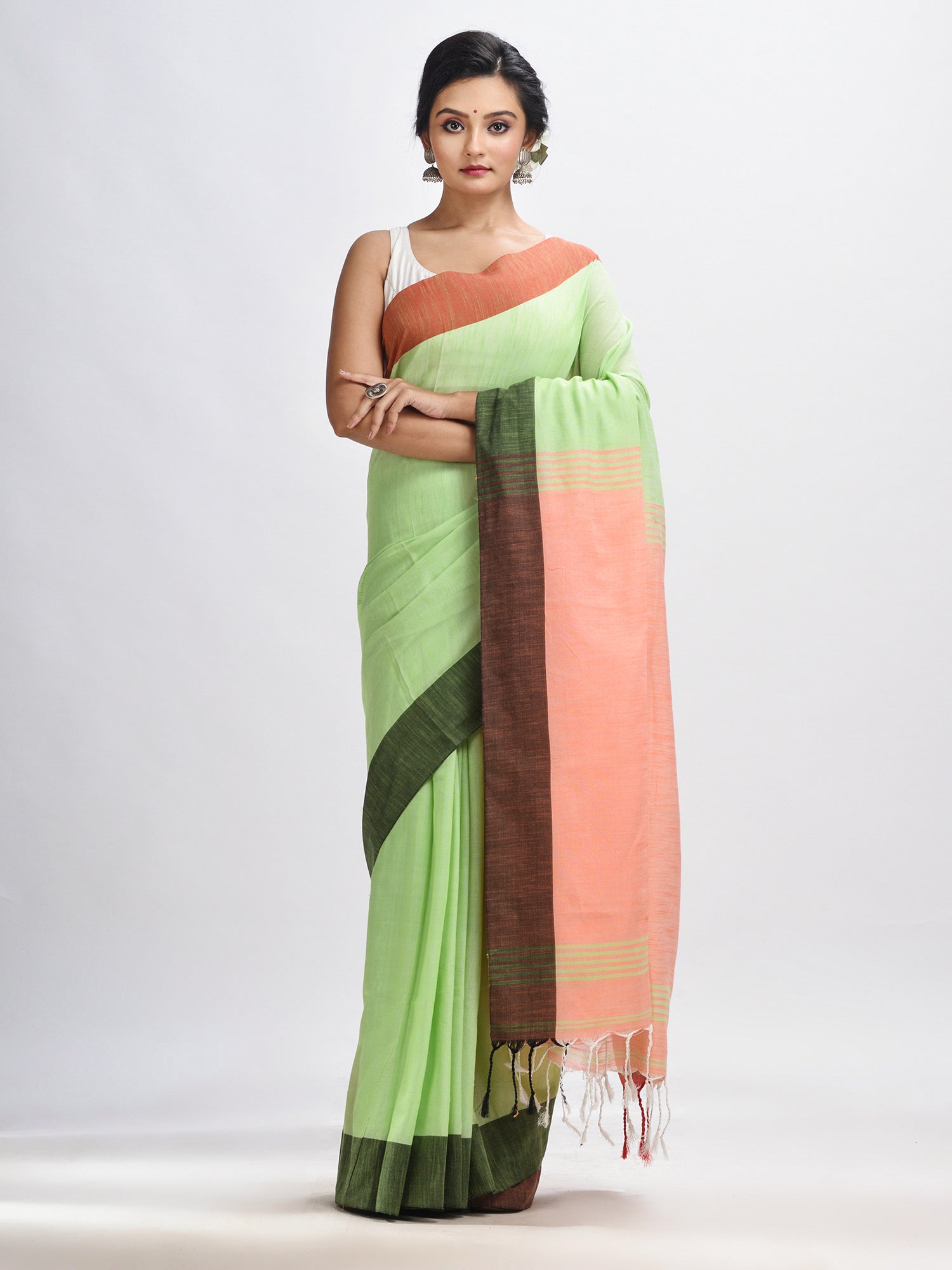 Women's Light green cotton with solid body in tawny peach pallu handloom saree - Angoshobha