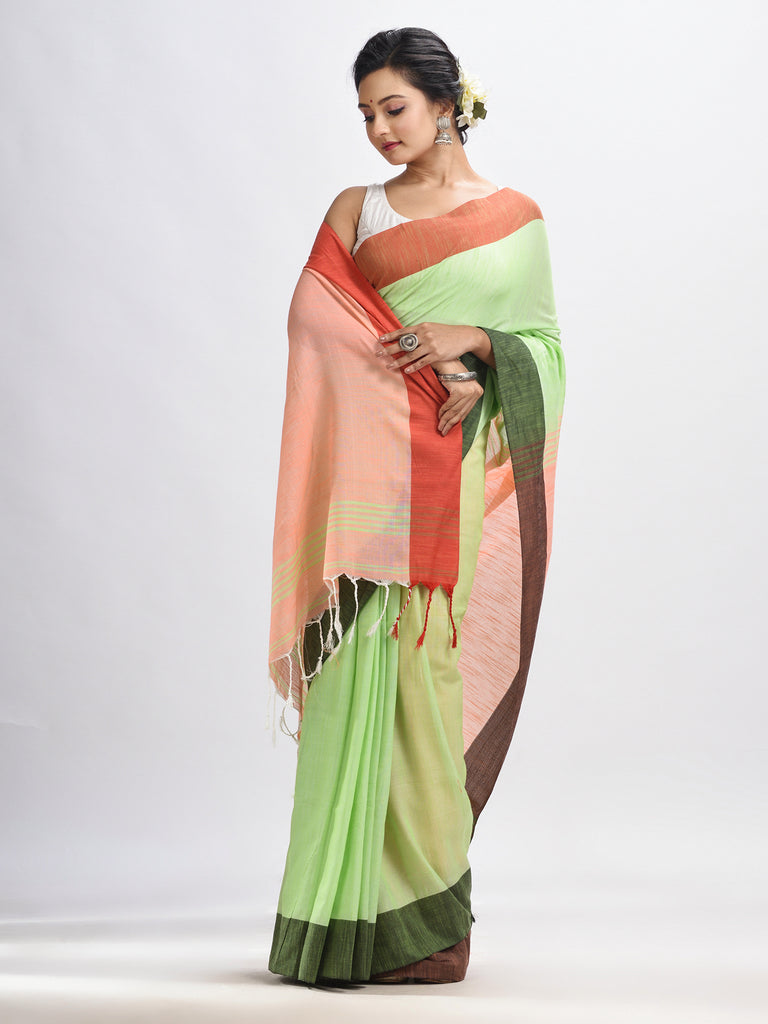 Women's Light green cotton with solid body in tawny peach pallu handloom saree