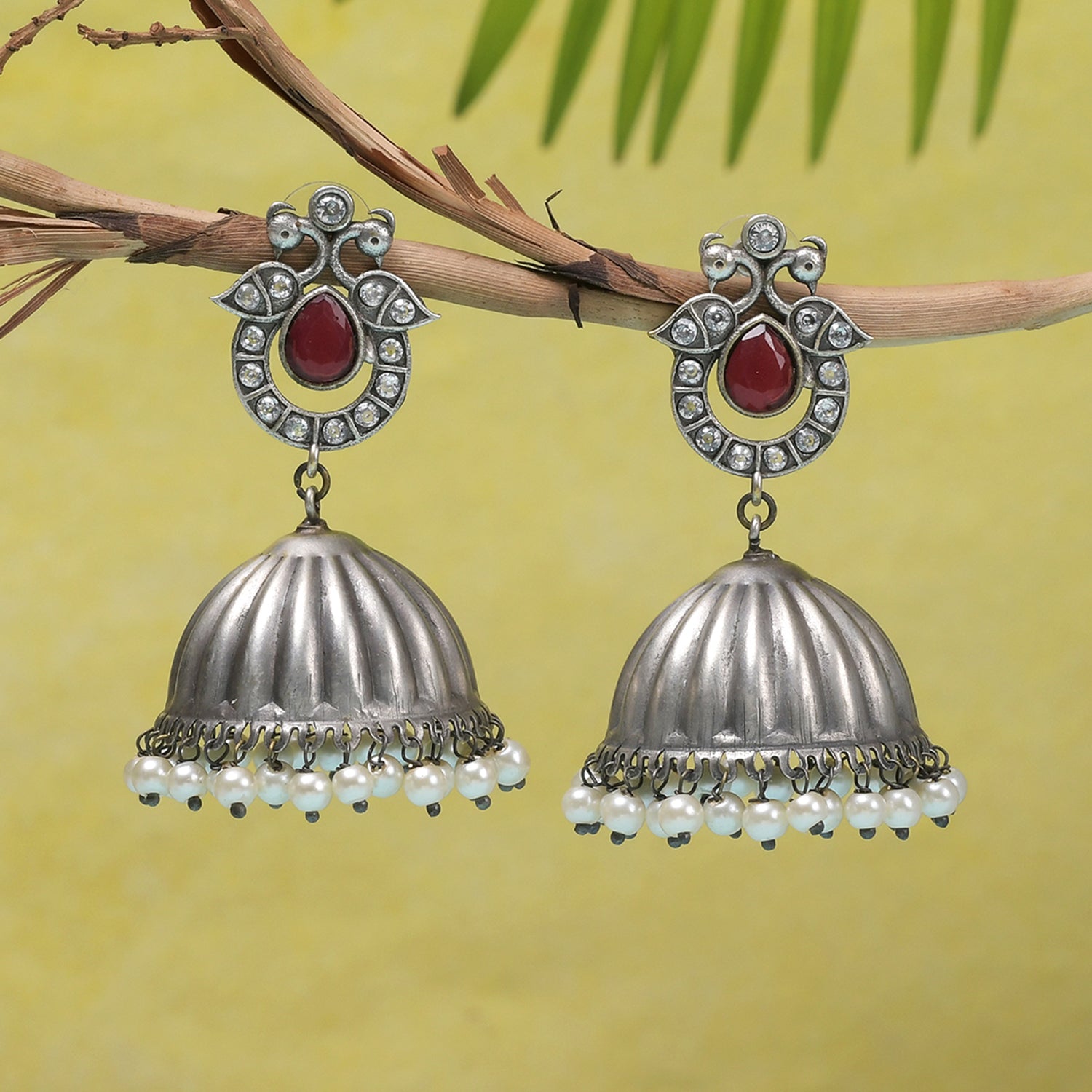 Women's Antique Elegance Peacock Motif Faux Pearls Adorned Brass Silver Plated Jhumka Earrings - Voylla