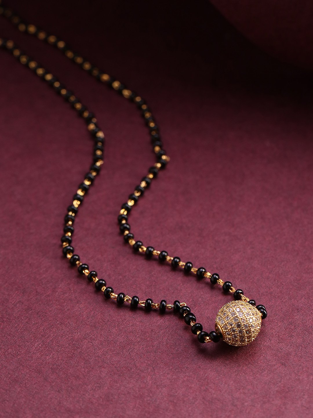 Women's Gold-Plated AD Studded Spherical Pendant Black Beaded Chain Mangalsutra - Priyaasi