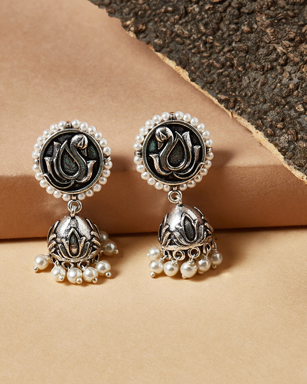 Women's Apsara Peacock Motif Faux Pearls Adorned Brass Silver Toned Jhumka Earrings - Voylla