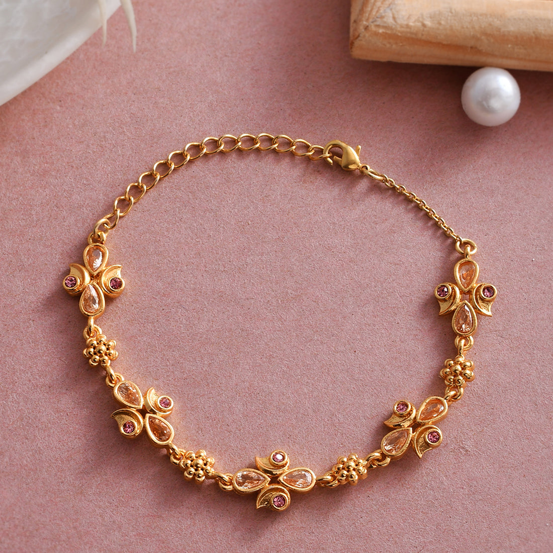 Women's Abharan Teardrop Cut Pink Stones Gold Plated Bracelet - Voylla
